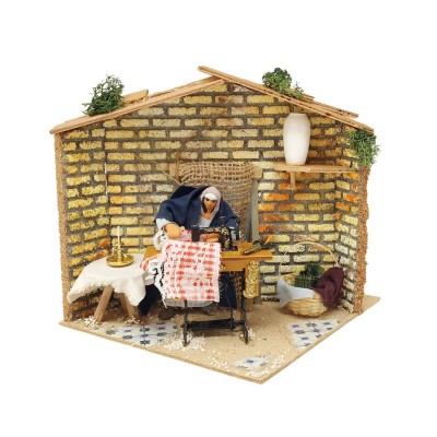 Pastore per Presepe in Movimento 17x17 cm Donna che Cuce